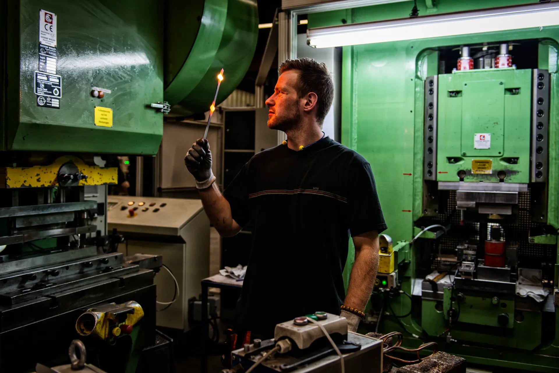 Man working with a torch in an industrial setting